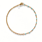 Chaîne cheville boules turquoises  et chaîne dorée