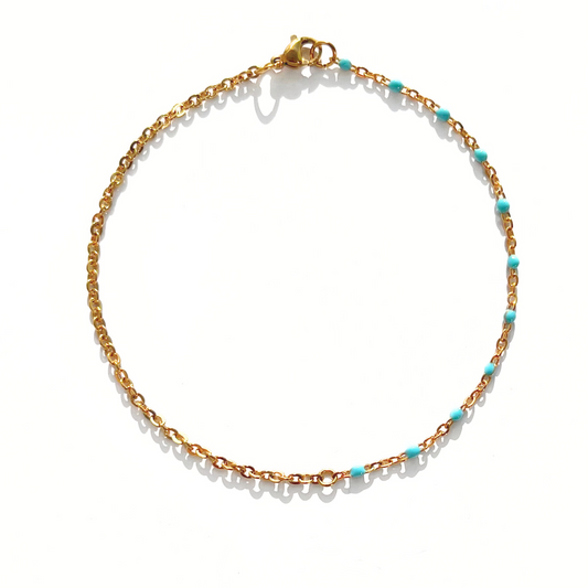 Chaîne cheville boules turquoises  et chaîne dorée